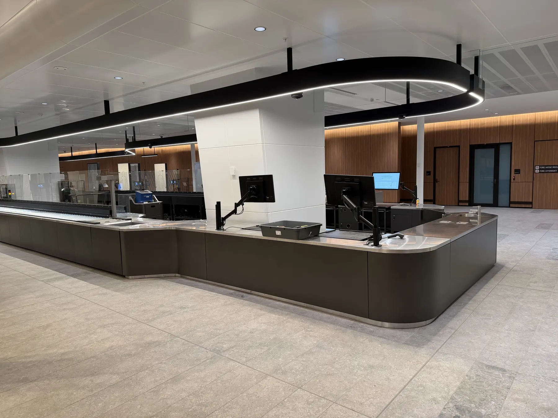 Curved check-in-counter joinery at Sydney Domestic Airport Terminal 2